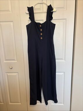 NWT Royal Monk Women's Navy Ruffle-Strap One-Piece Jumpsuit. Size Medium.